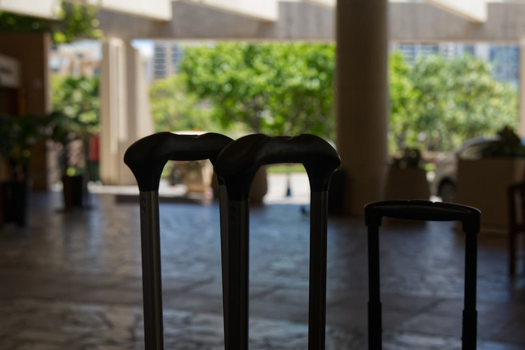 Three suitcases stand in a hotel lobby on Miles and Memories