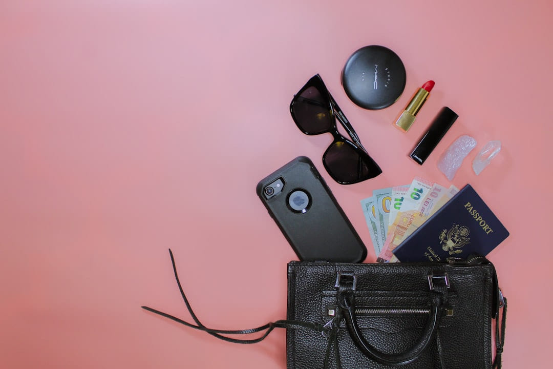 black sunglasses on black leather pouch on Miles and Memories