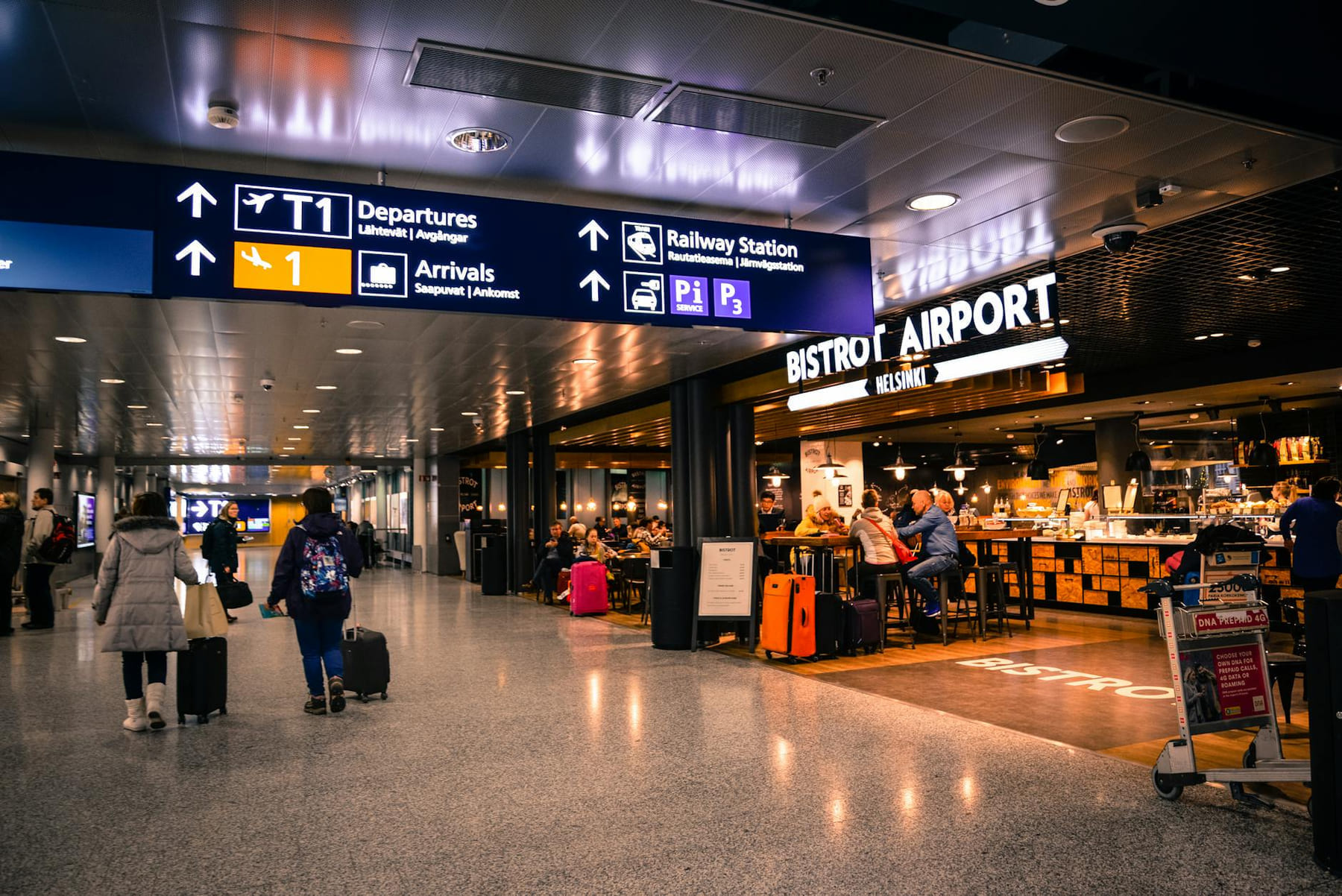 Travelers at Helsinki Airport dining and shopping near departures and arrivals. on Miles and Memories