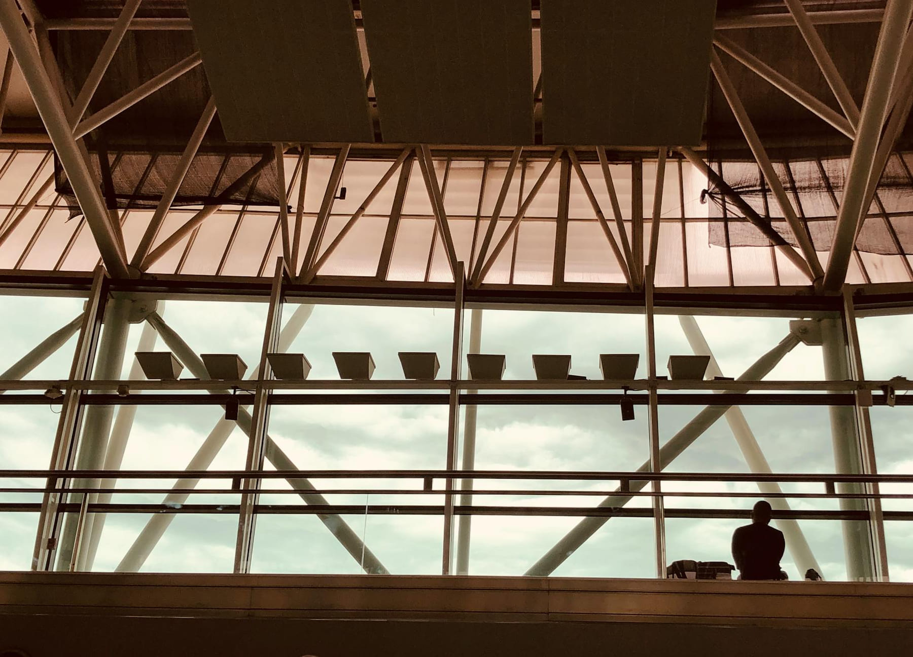 Silhouette of a person in Buenos Aires Ezeiza Airport's modern architectural design. on Miles and Memories